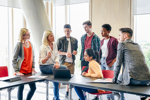 Divon Academy Instructor in class with students all around