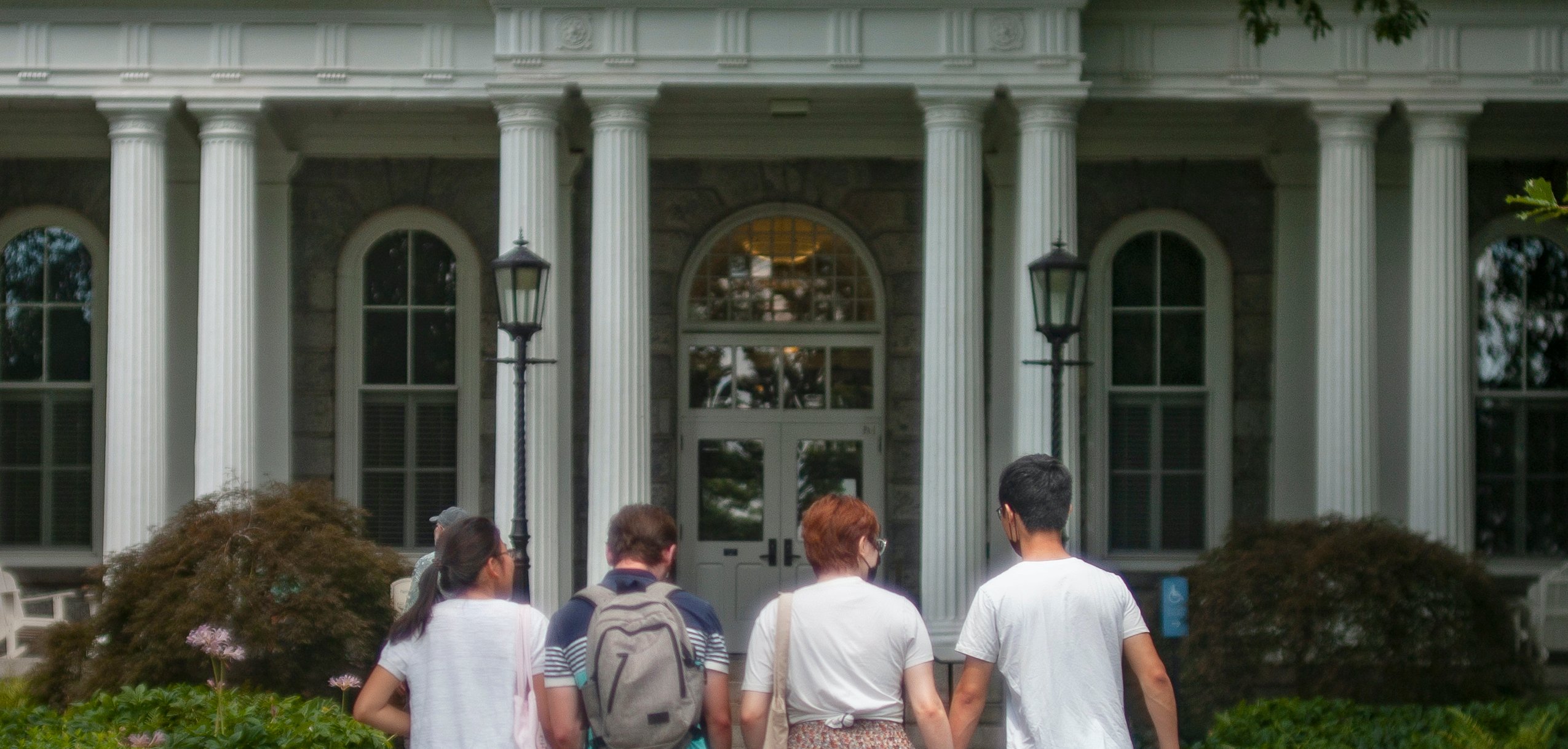 Swarthmore students walking in front of main building